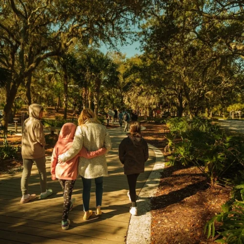 Abbey and kids walking through a park