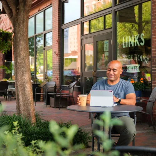 image of man in front of a coffee shop in Danville, VA