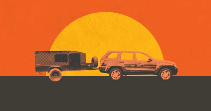 An SUV pulling a camper against an abstract sunset