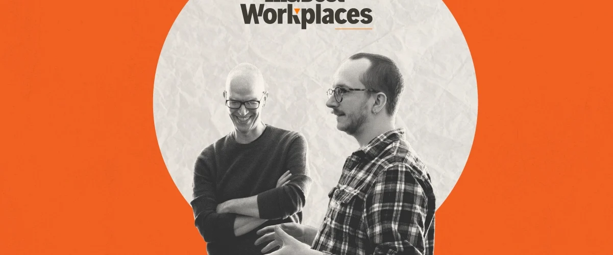 DR Employees Jonathan Danz and Justin Ferrell give a collaborative presentation beneath the official Inc Best Workplace logo