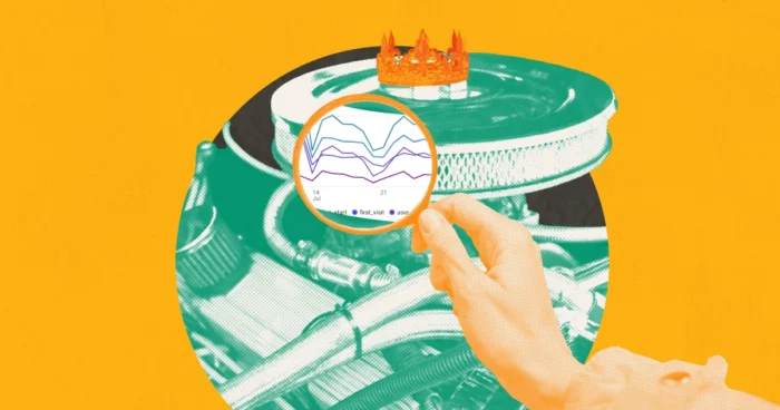 Hand holding magnifying glass over vinyl record with crown, on orange background.