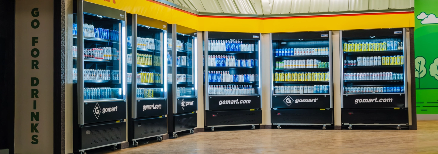 The GoMart branded Grab N' Go Area in the Charleston Civic Center - featuring GoMart branded drink coolers in a long row with many drink varieties available