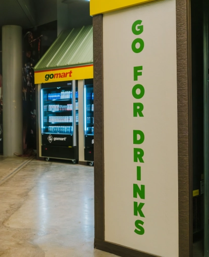 The GoMart branded Grab N' Go Area in the Charleston Civic Center - featuring GoMart branded drink coolers in a long row with many drink varieties available