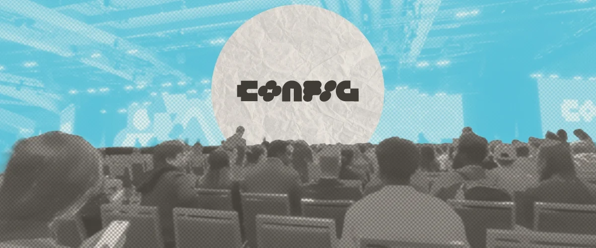 Audience seated at a conference venue with "Config" logo displayed on a large screen at the front.