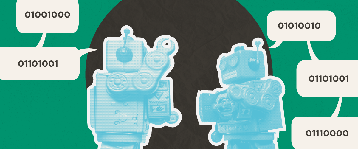 Two toy robots have a conversation in binary code. The binary spells "Hi Rip" (the nickname for Justin's child)