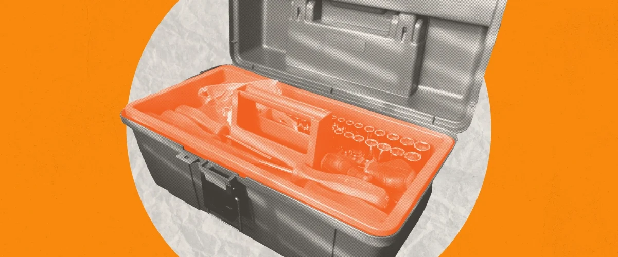 A tool box open to reveal a bright orange interior on a white circle against a light orange background