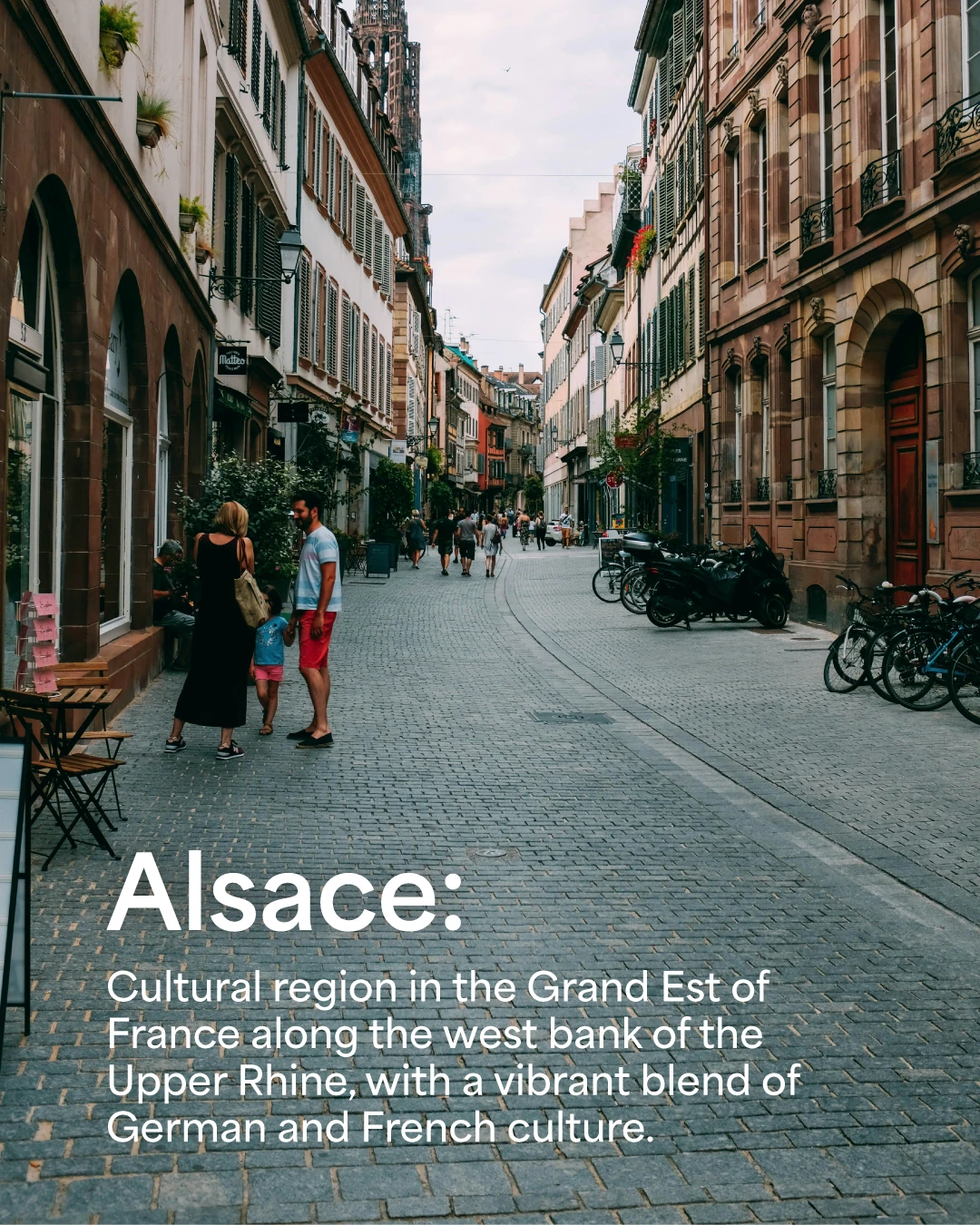 Mock social media ad showing a pedestrian street in Strasbourg with people walking among historic buildings. It reads "Alsace: Culture region in the Grand Est of France along the west bank of the Upper Rhine, with a vibrant blend of German and French culture"