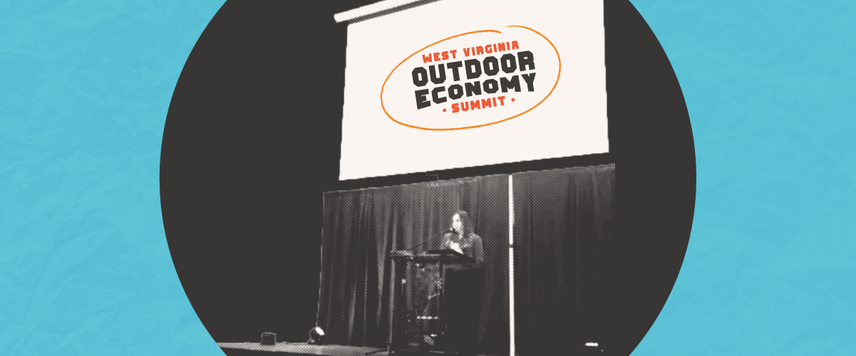 A woman on the stage at the West Virginia outdoor economy summit