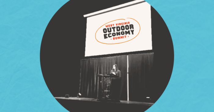 A woman on the stage at the West Virginia outdoor economy summit