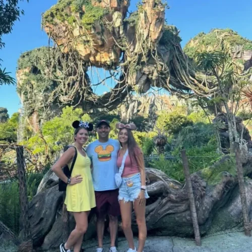 Hannah posing with her family at Disney's Animal Kingdom