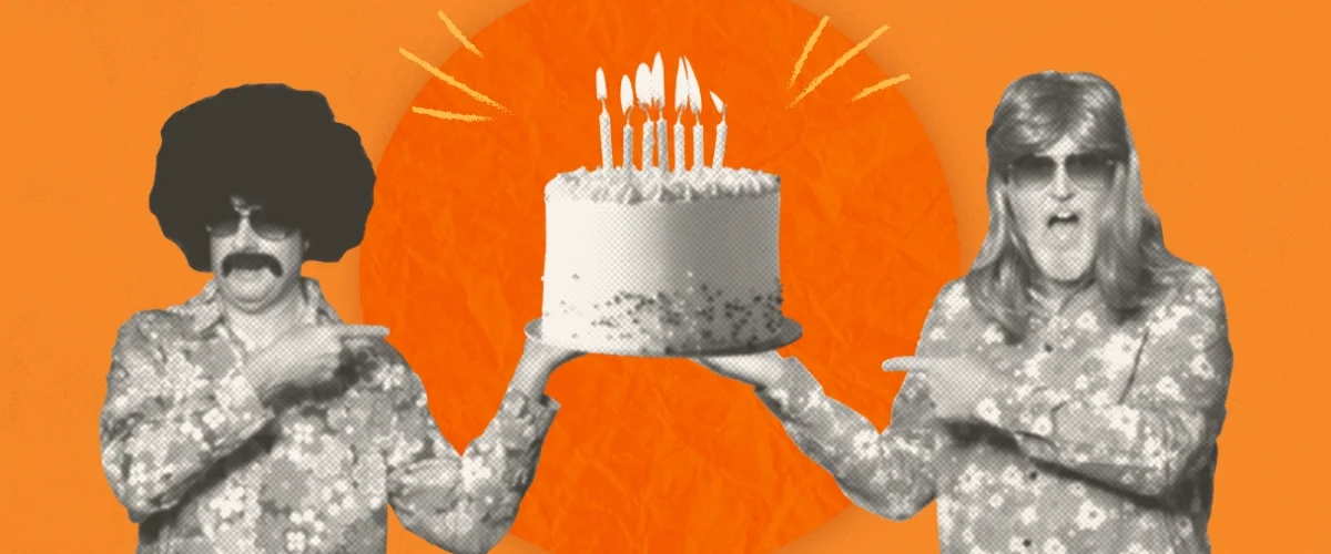 GoMart's Groovy Guys in retro 70s wigs, sunglasses and floral shirts hold a lit birthday cake against an orange background